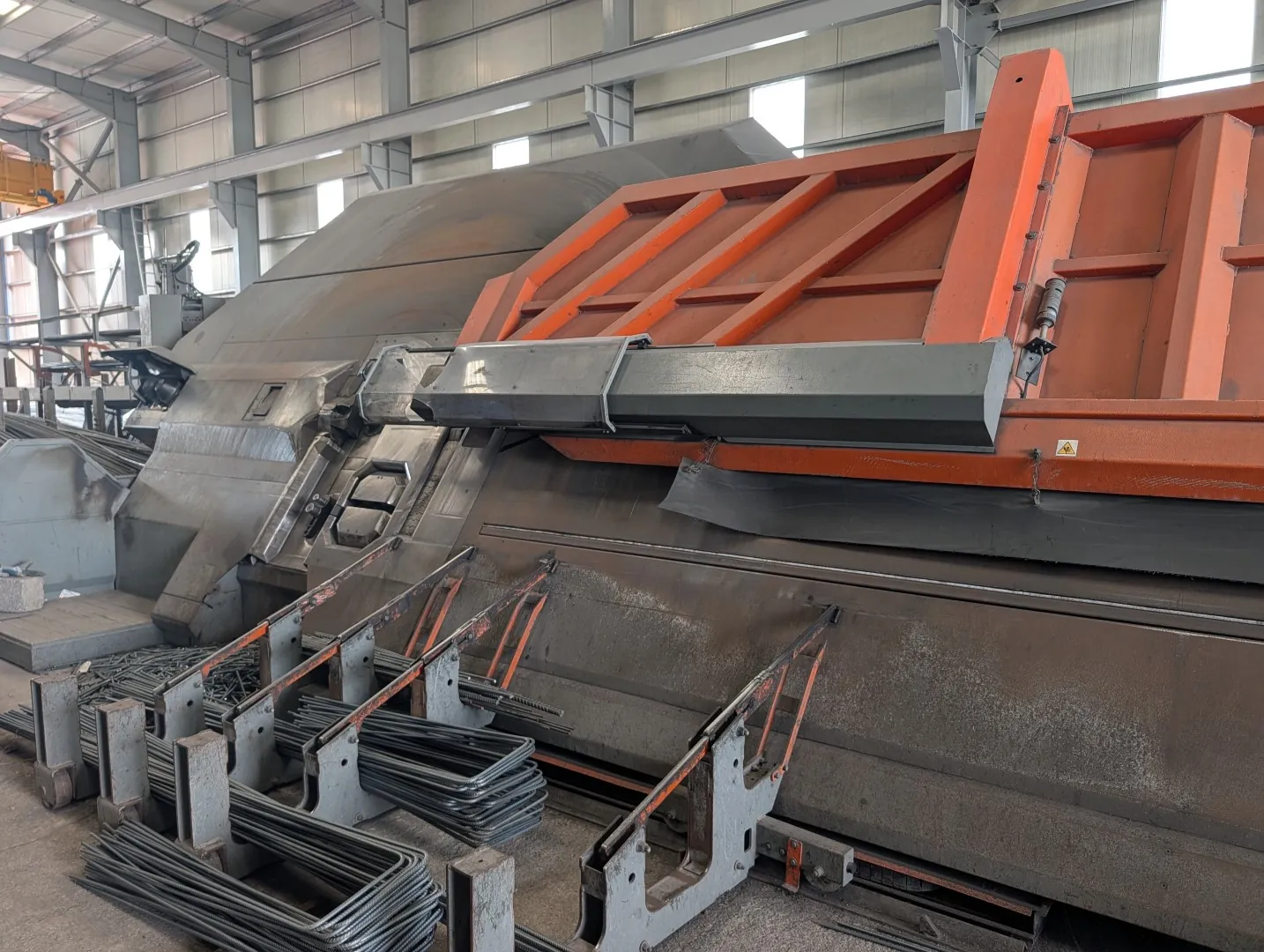 Automatic stirrup bending machine at Dubar, with finished links and stirrups on the collection rack